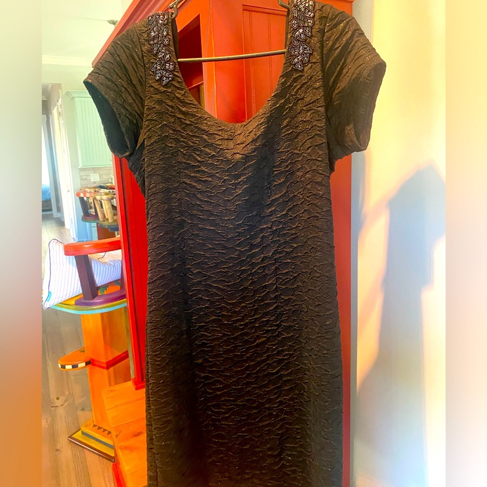 Free People evening wear. Black glitter knee length dress with beading detail